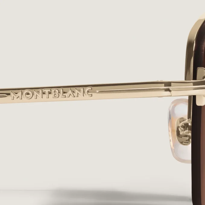 Gafas de sol ovaladas con montura metálica dorada